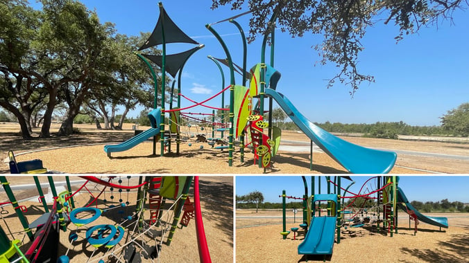 Multi-level Smart Play Tree Tops playground structure at Devine Lake Park in Leander, Texas, featuring wiggly bridges, O-Zone 3-ring climber, dual slides, and built-in shade over engineered wood fiber surfacing.