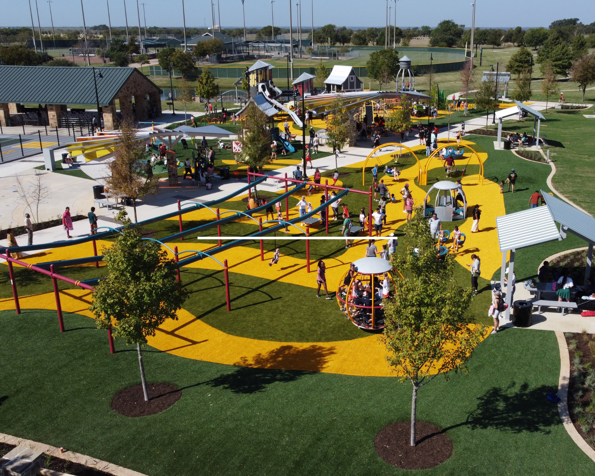 Old Celina Park playground design and construction featuring custom three-tower structure in Celina Texas