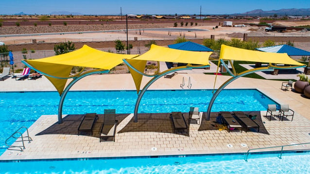 Shaded retreat at pools and splash pads: Fabric shade structures offer sun protection and comfort for swimmers and visitors.