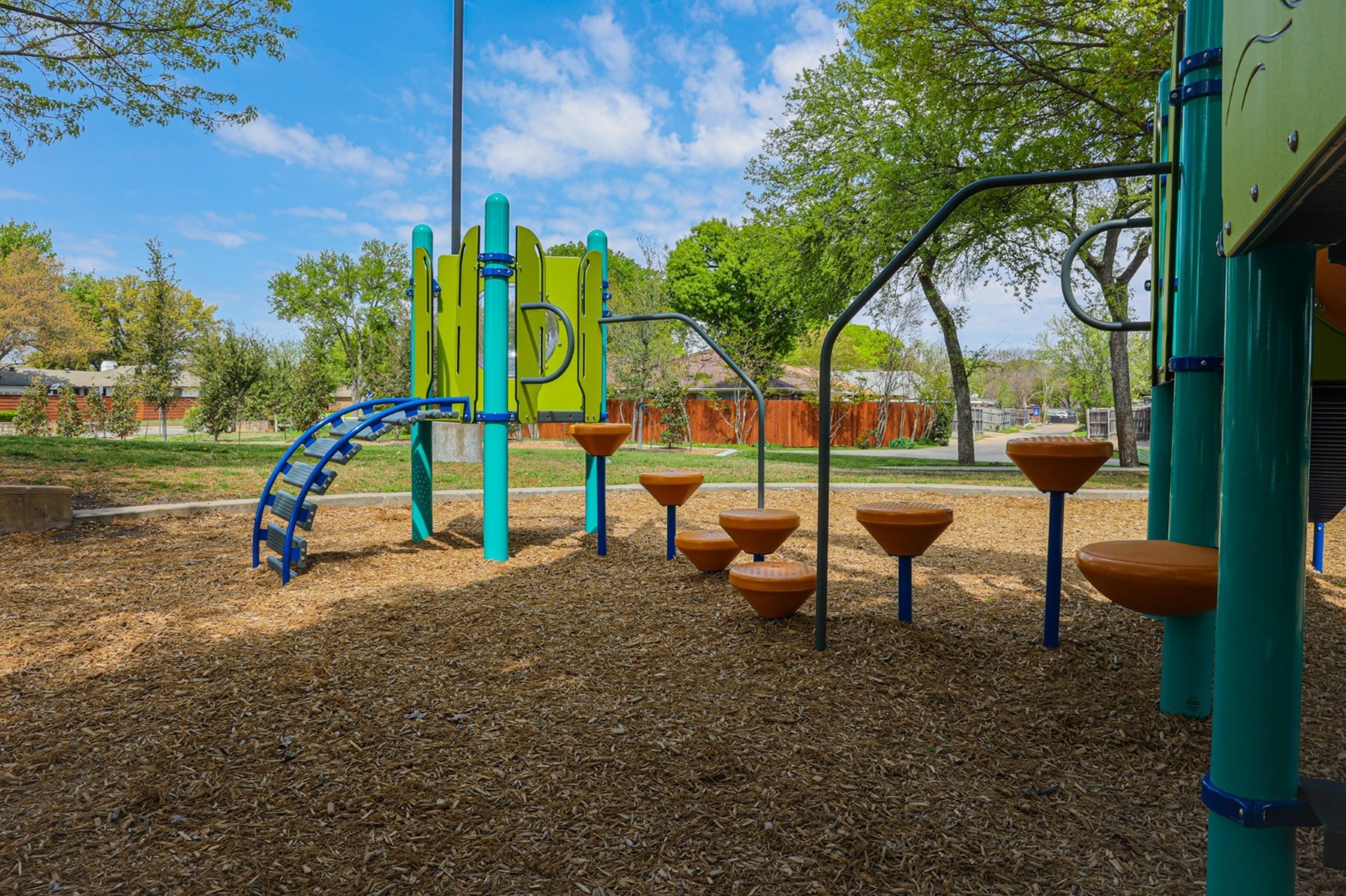 Inclusiveness at Woodhaven Grove Park: Pod Climber® steps create a welcoming path, fostering play for all playground visitors.